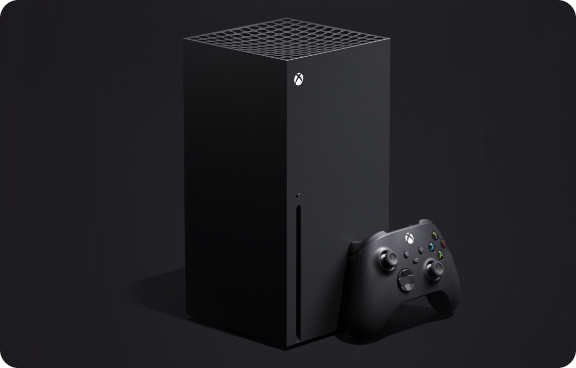 An image of an Xbox console with a conroller leaning against it
